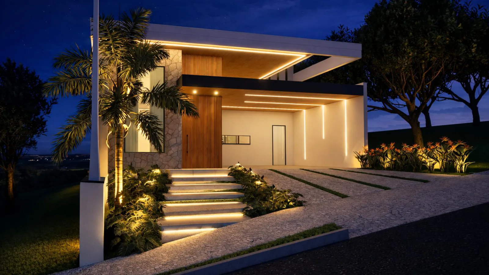 Fachada noturna iluminada da residência — projeto Grupo Adriel