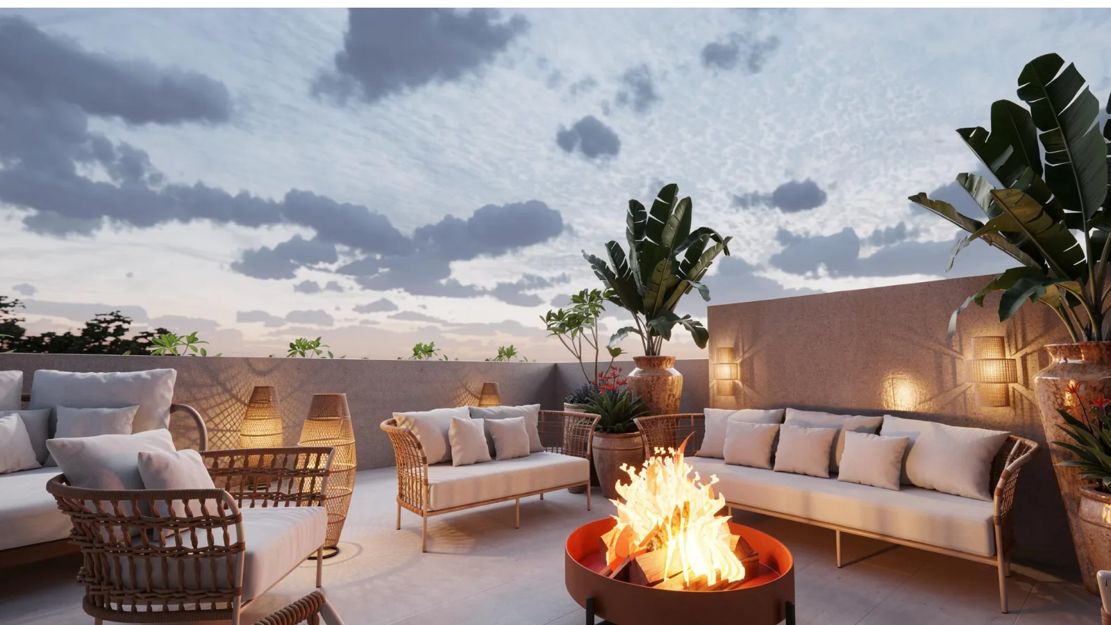 Lounge do rooftop ao entardecer com lareira de fogo — projeto Grupo Adriel